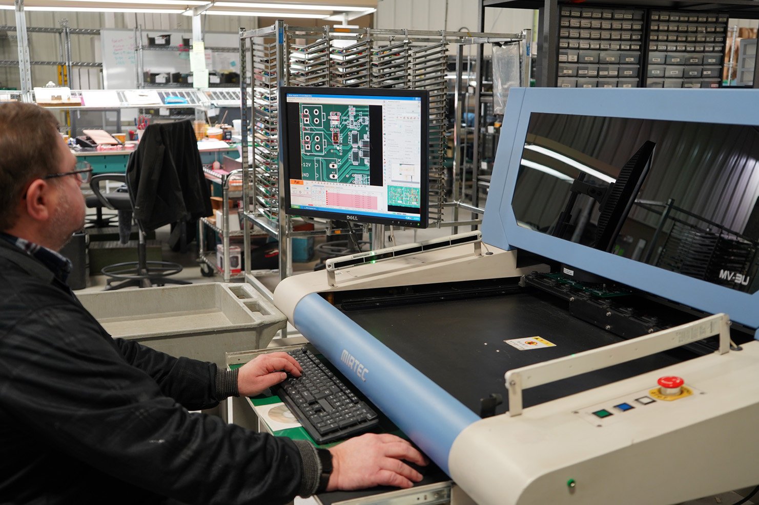 Man reviewing results of AOI Inspection