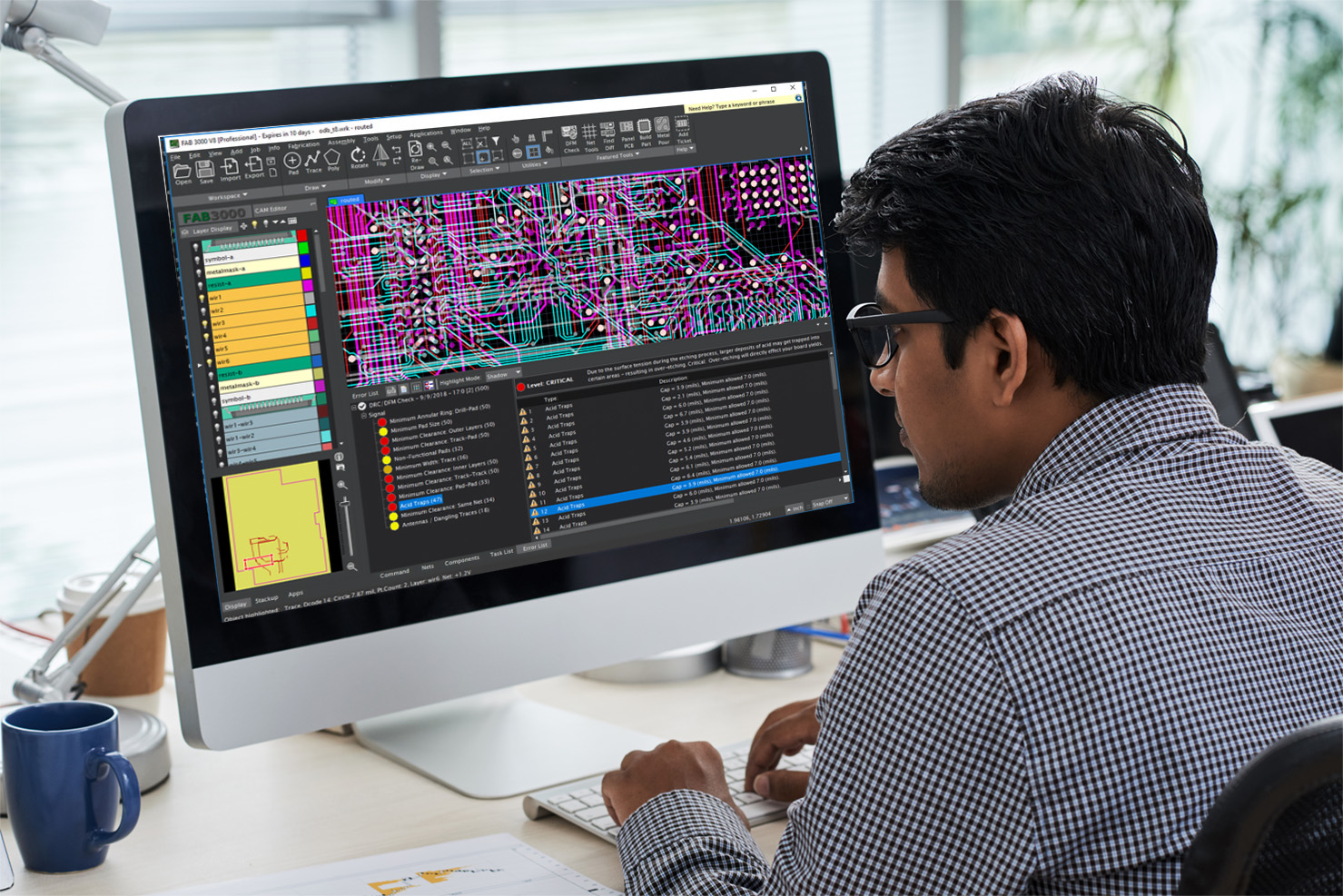 Developer in front of computer creating design