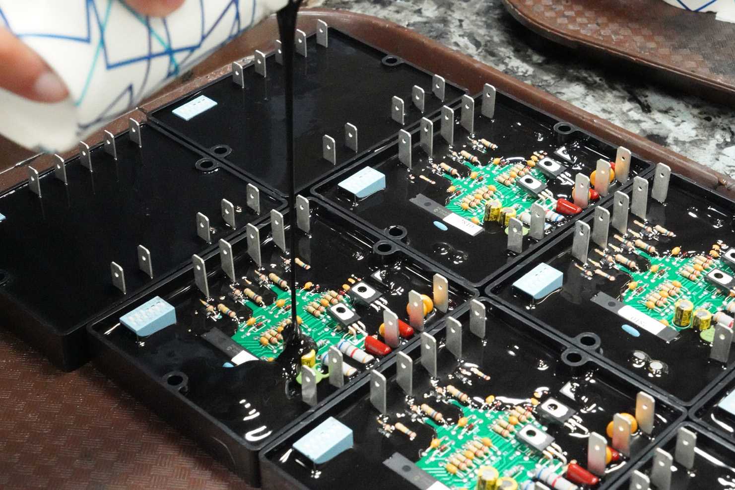PCB board being encapsulated in resin epoxy