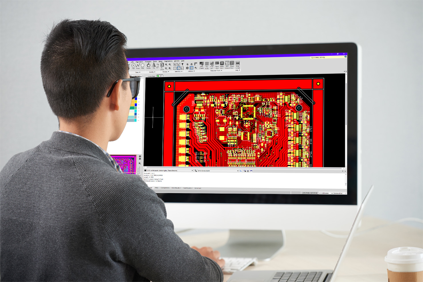 Man at computer designing PCB board