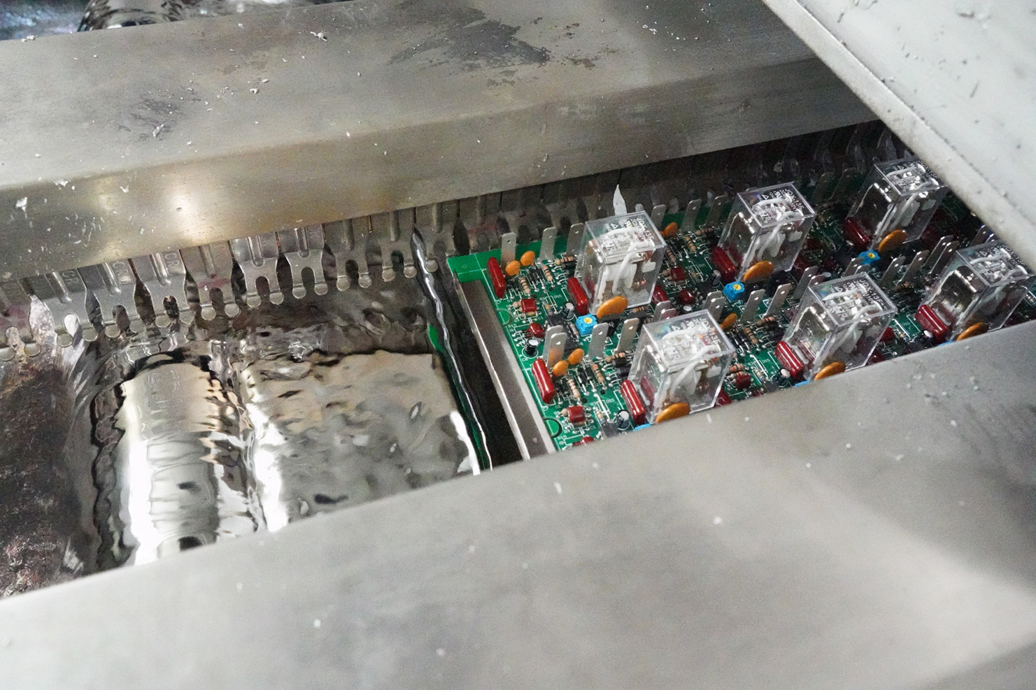 PCB Board moving over wave of solder